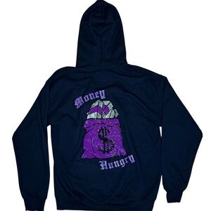 hoodie with purple bedazzled money bag design